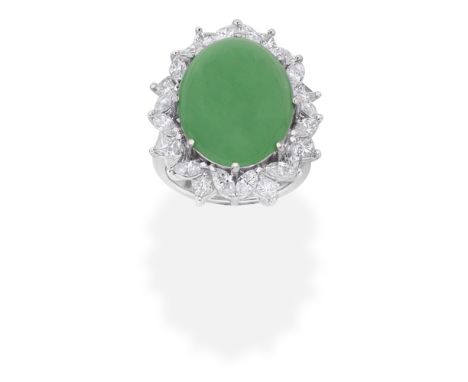 JADE AND DIAMOND RINGThe oval jadeite jade cabochon within a marquise and princess-cut diamond surround, diamonds approx. 1.2