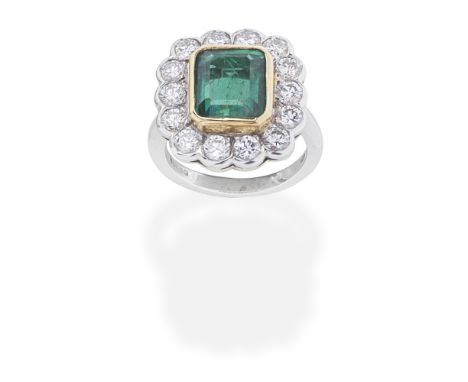 EMERALD AND DIAMOND CLUSTER RINGThe step-cut emerald within a brilliant-cut diamond surround, mounted in 18 carat gold, diamo