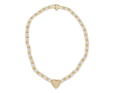 CULTURED PEARL AND DIAMOND NECKLACE, 1982Set with a brilliant-cut diamond heart-shaped pendant, issuing two rows of 3.5mm cul