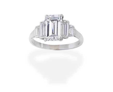 DIAMOND RINGThe step-cut diamond, weighing 2.42 carats, between baguette-cut diamond shoulders, ring size approx. L½For furth
