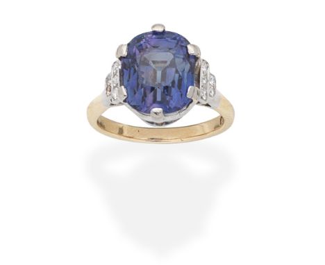 COLOUR-CHANGE SAPPHIRE AND DIAMOND RINGThe cushion-shaped colour-change sapphire between single-cut diamond shoulders, one di