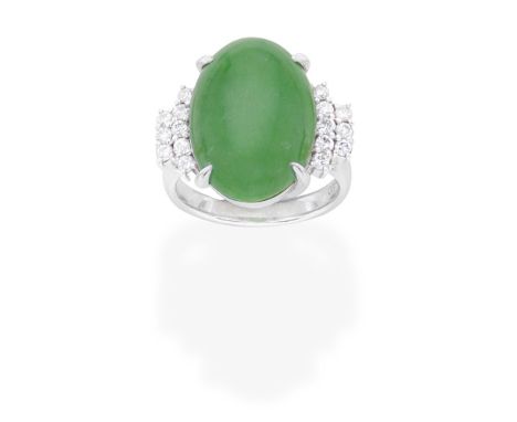 JADE AND DIAMOND RINGThe oval jadeite jade cabochon set between brilliant-cut diamond shoulders, ring size approx. LFootnotes