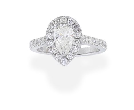DIAMOND CLUSTER RINGThe pear-shaped diamond within a brilliant-cut diamond surround and shoulders, principal diamond approx. 