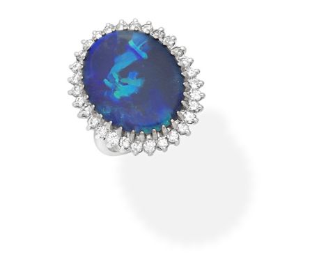 OPAL AND DIAMOND CLUSTER RINGThe oval opal cabochon, within a brilliant-cut diamond surround, ring size approx. MFor further 