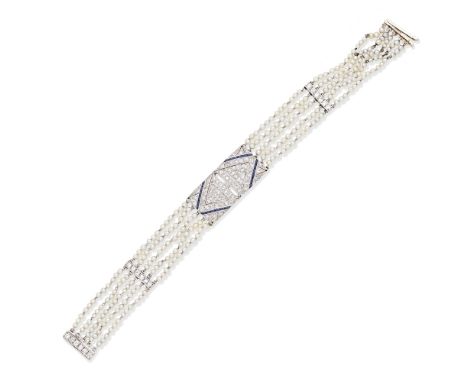 DIAMOND, SAPPHIRE AND SEED PEARL BRACELET, CIRCA 1910The central plaque of openwork design reading SHE, set with single-cut d