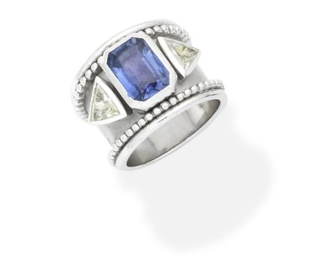 SAPPHIRE AND DIAMOND RINGThe wide tapered band set with an octagonal-cut sapphire and trilliant-cut diamonds, within a brushe