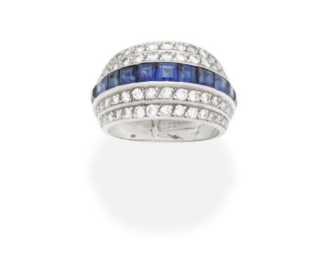 ART DECO SAPPHIRE AND DIAMOND DRESS RING, CIRCA 1930The central band of calibré-cut sapphires between rows of single and bril