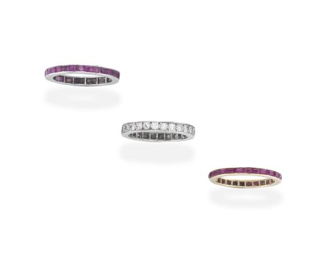 TWO RUBY ETERNITY RINGS; ONE DIAMOND ETERNITY RING1st: Each ring set throughout with step-cut rubies, 2nd: Set throughout wit