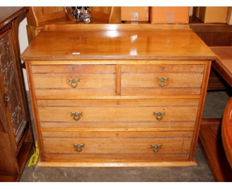 An Edwardian Maple &amp; Co. chest of two short and two long drawers, 105cm wide
