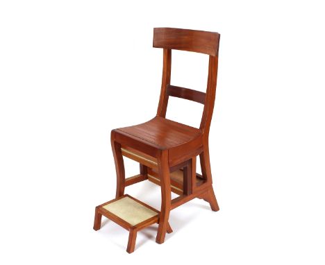 A contemporary teak metamorphic library step chair; and matching stool