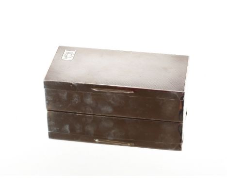 An Art Deco silver mounted engine turned decorated two compartment cigarette box, London 1934