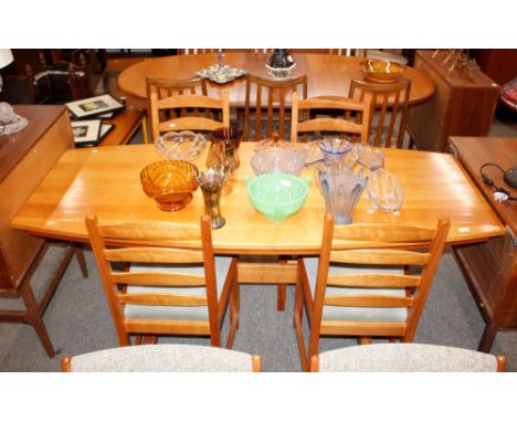 A light wood kitchen dining table, the shaped top raised on trestle end supports, 80cm x 177cm; and for matching ladder back 