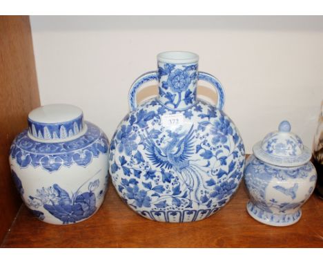 A Chinese blue and white pottery moon flask, ginger jar and cover; and a baluster vase and cover