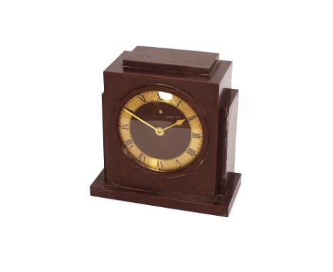 An Art Deco design brown Bakelite cased electric mantel clock 