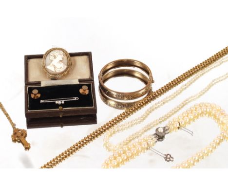 Two strings of graduated pearls set to white and yellow metal decorated clasps; a yellow metal Celtic pendant on fine link ch