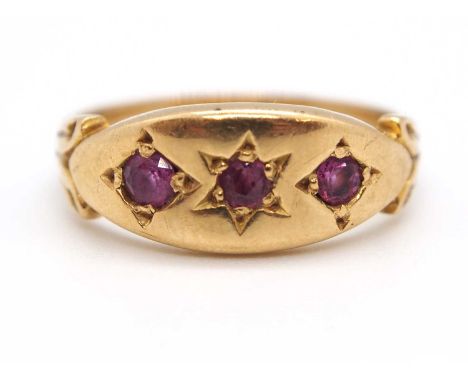 An 9ct ruby ring, the three round gypsy set rubies with plain band stamped 9ct, size I-J, 2.9g