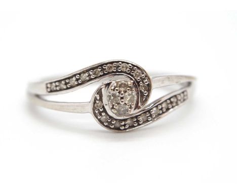 A 9ct diamond ring, set to centre with four small round diamonds, with an asymetric sweep of additional small rounds diamonds