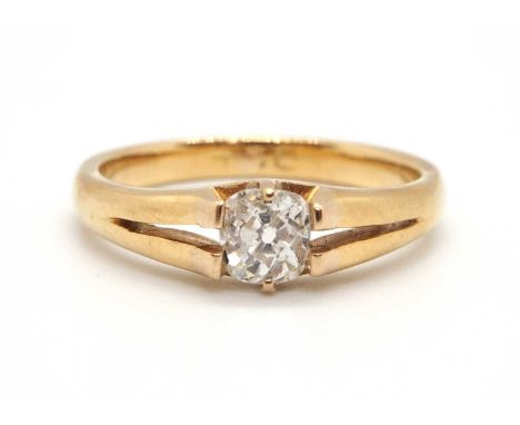 A diamond solitaire ring, the old mine cut diamond, estimated approx. 0.49cts, claw and tension mounted with split shoulders 