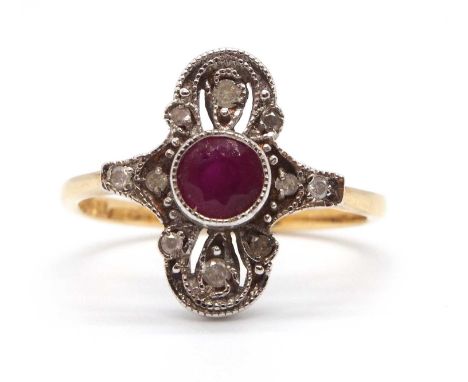 An Edwardian style 18ct ruby and diamond ring, the central round ruby set within a plaque set with small diamond highlights, 