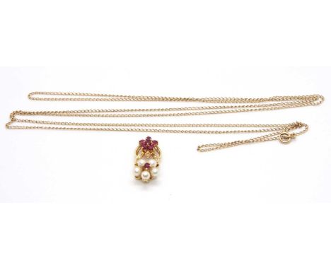 An 18ct ruby diamond and cultured pearl necklace, the pendant set with a flowerhead cluster of cultured pearls with a small r