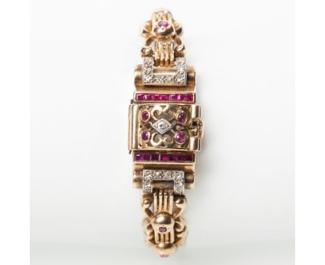 UNUSUAL LADY'S RUBY AND DIAMOND NINE CARAT GOLD COCKTAIL WATCH
unsigned seventeen jewels manual wind movement, the white dial