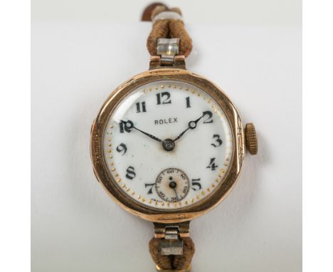 LADY'S EARLY TWENTIETH CENTURY NINE CARAT GOLD ROLEX COCKTAIL WATCH
signed fifteen jewels manual wind movement, the white dia