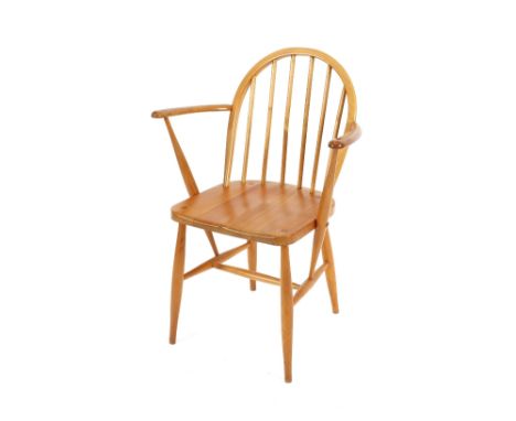 An Ercol stick back kitchen elbow chair 