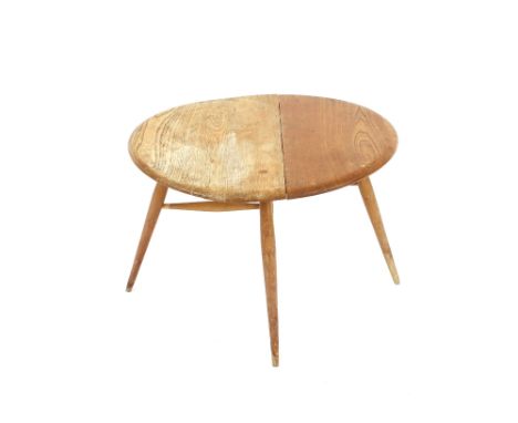 A small light Ercol drop leaf coffee table, 60cm dia.