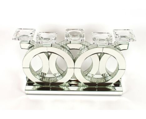 A decorative mirrored and crystal five light candle holder, 55.5cm wide 