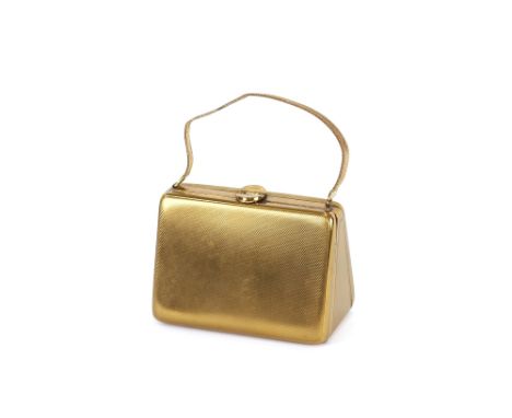 An Art Deco design compact in the form of a handbag with engine turned decoration