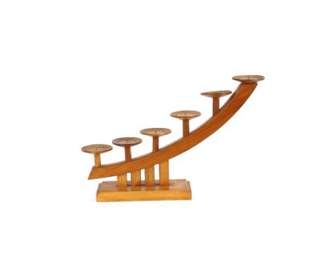 A wooden graduated six light candle stand, 35.5cm high x 54cm wide overall