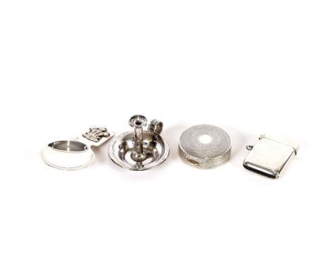 A small circular silver compact with engine turned decoration; a silver Vesta case; a modern silver caddy spoon with Prince o