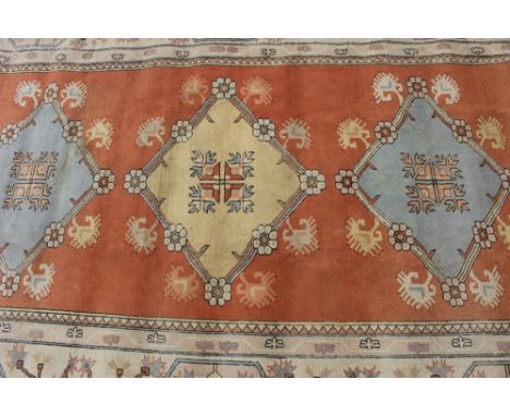 A large Eastern carpet in the Caucasian manner, approx. 10ft 9ins x 15ft 11ins