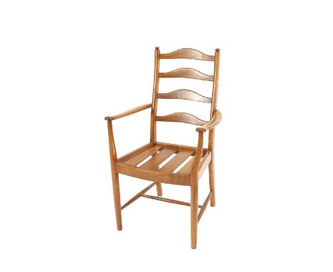 A set of six light Ercol ladder back dining chairs, four standards, two elbows