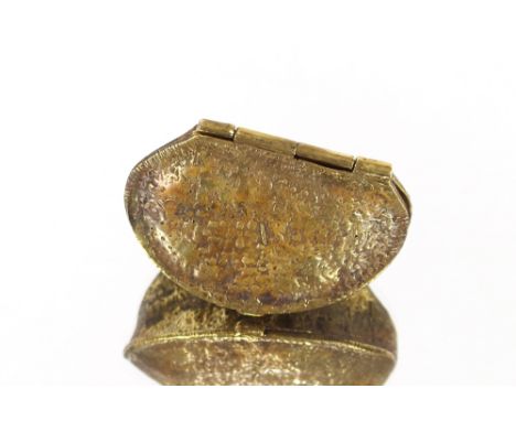 A gilt metal snuff box in the form of a nut 