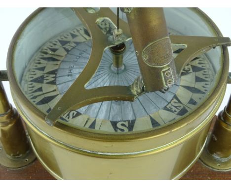 An early 20th century brass ships compass, Lord Kelvin patent, with paper dial, on gimballed brass stand and wooden base, cas