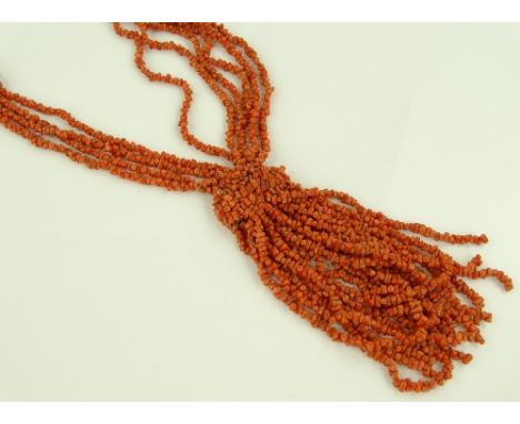 A Vintage long 10 strand coral necklace, with drop coral tassel