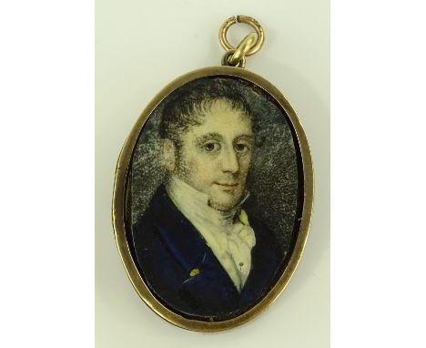 A miniature watercolour portrait of a gentleman, in unmarked gilt metal frame, height 40mm