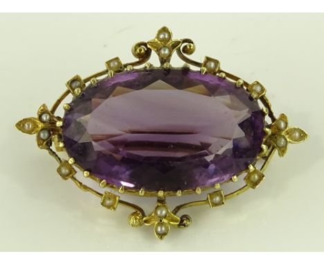 A Victorian large amethyst and seed pearl set brooch, unmarked gold settings, length 40mm, 9.6g