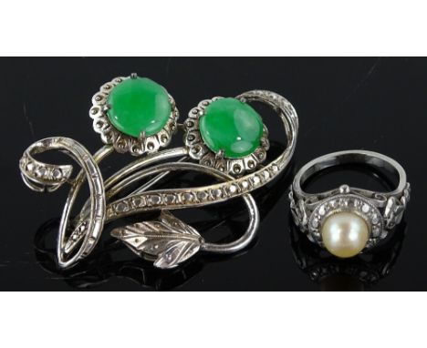 An 18ct white gold jade floral pendant, together with an unmarked white metal and pearl set ring (2)