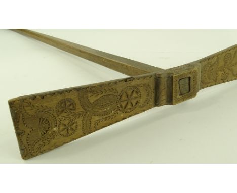 A Scandinavian wooden ceremonial marriage axe, with carved head, length 1.35m
