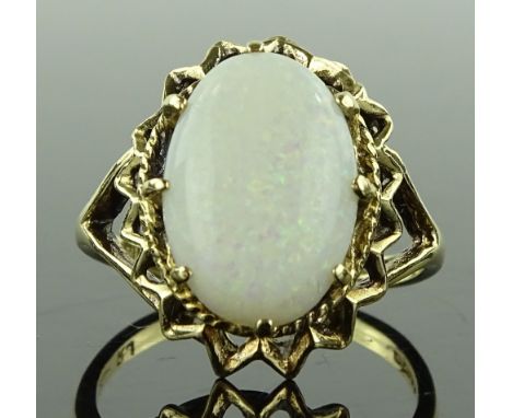 A 9ct gold cabochon opal set ring, openwork shoulders and bridge, setting height 18.5mm, size P, 3.9g