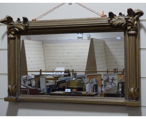 An ornate 19th century carved giltwood acanthus design over mantel mirror, width 3'5", height 2'.