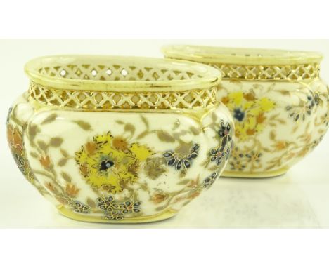 A pair of Zsolnay Pecs oval ceramic gilded and painted pots, with pierced rims, length 8.5cm