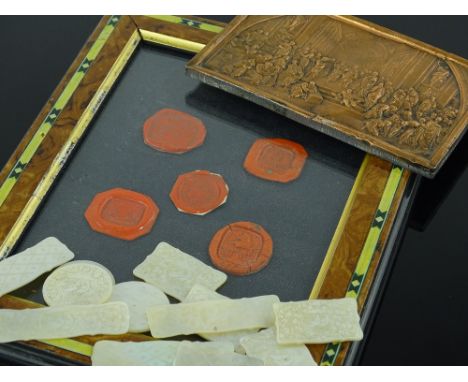 A relief cast metal plaque, length 14.5cm, a group of Chinese engraved mother-of-pearl gaming counters, and a framed set of w