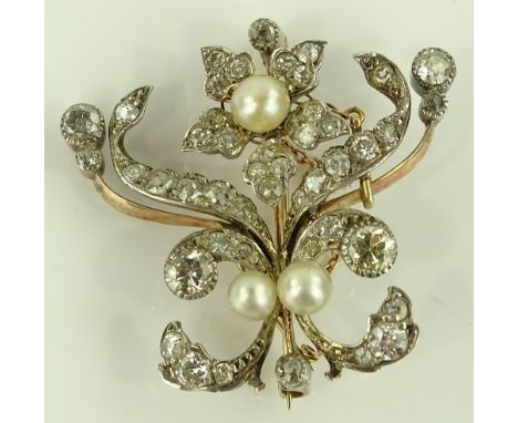 An unmarked gold diamond and pearl floral spray brooch, height 34.5mm, 9.9g