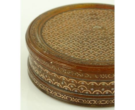 A 19th century circular tortoiseshell snuff box with gold and silver pique inlay, diameter 6.5cm