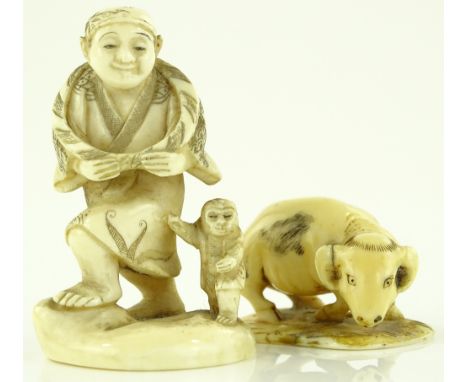 A Japanese Meiji period carved ivory netsuke, depicting a man and a monkey, red seal signature under base, height 5cm, togeth