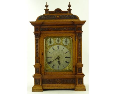 A superb quality, late Victorian, golden oak cased mantel clock, relief carved columns and pediment, the elaborate engraved s