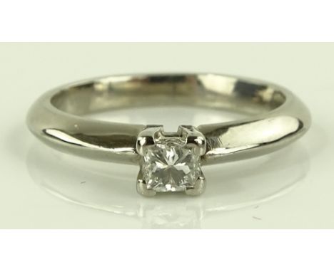 An 18ct white gold solitaire diamond ring, princess cut diamond approx 0.25cts, unmarked settings, size K, 3.6g